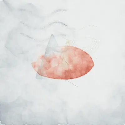 a paper boat on a puddle